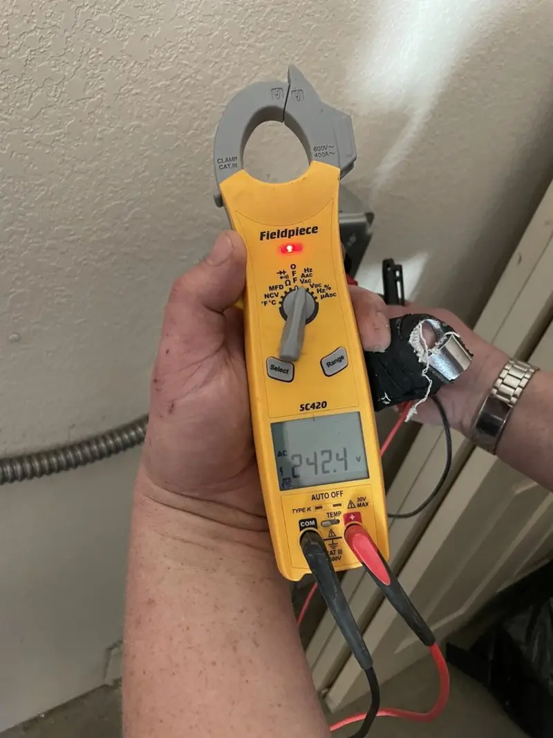 Voltage testing with clamp meter during Outlet Installation in Wabash